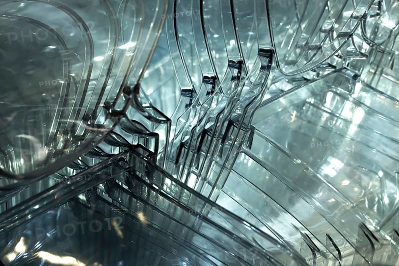 Illuminated Plastic Chairs Stacked in Switzerland