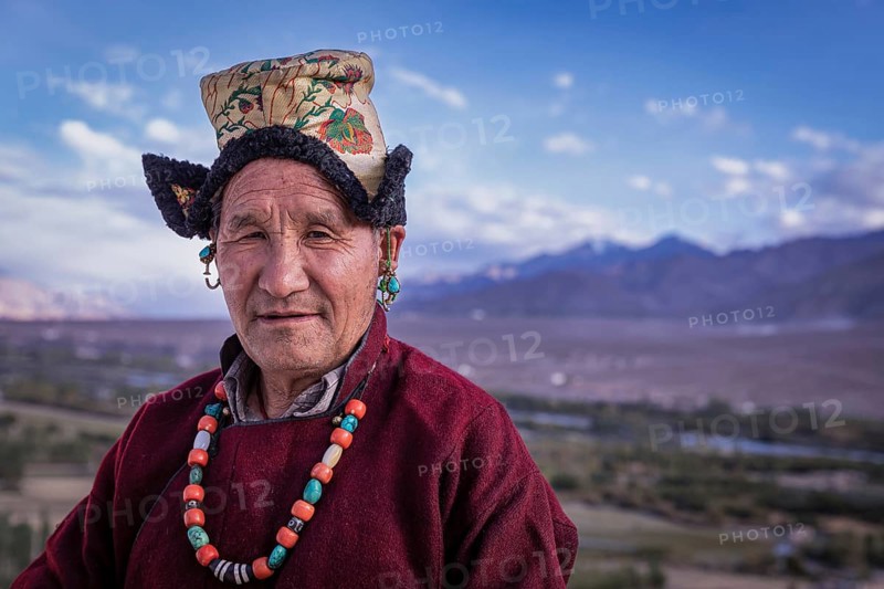 Elderly man in traditional Ladakhi clothes