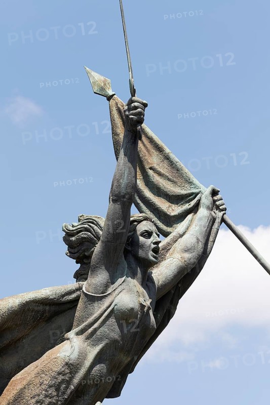 Woman with raised sword and flag