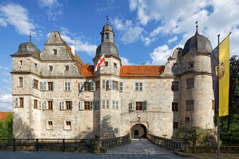 North-west side of Mitwitz moated castle with stone bridge and entrance portal