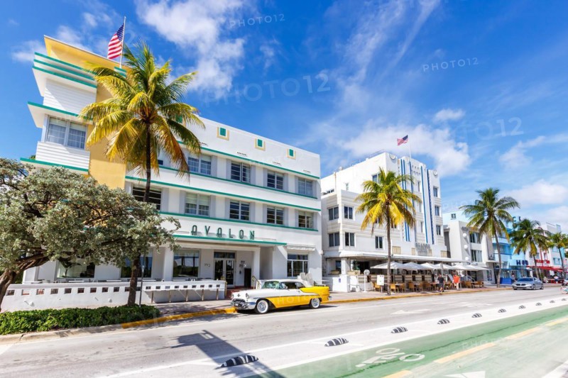 Avalon Hotel in Art Deco style architecture and vintage car on Ocean Drive in Miami Beach