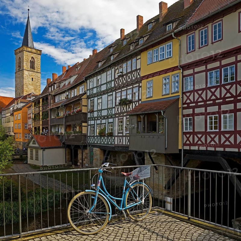 Half-timbered houses of the Kraemerbruecke with the river Gera and the Aegidienkirche