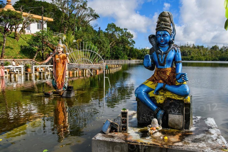 Right Sculpture Figure Statue of Hindu God Hindu Deity Shiva of Hindu Religion Left Woman Wife of Shiva Parvati in Lake Sacred Hindu Lake Ganga Talao