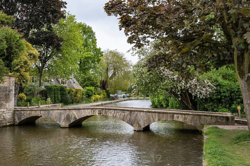 Old footbridge over the River Windrush in the Old Town of