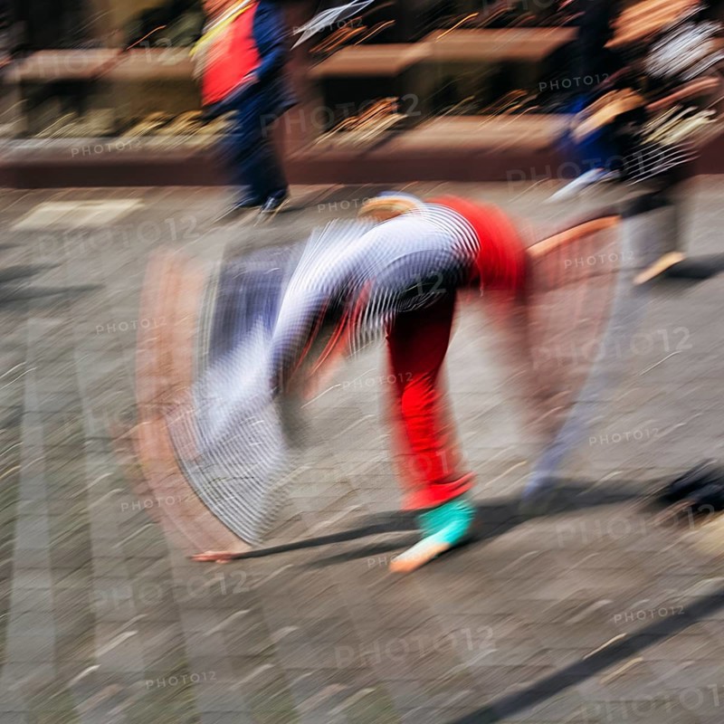 Colourful clown beats a wheel