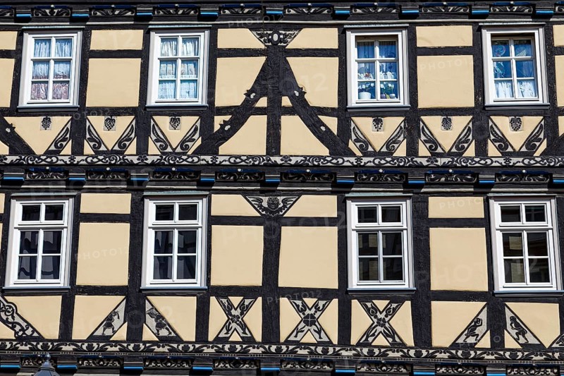 Details on magnificent half-timbered house with ornate wood carving