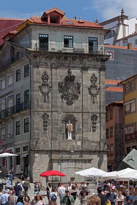 Monumental fountain Fonte da Praca da Ribeira with modern sculpture St. John the Baptist