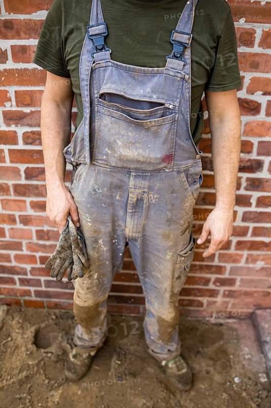 Dirty and tattered dungarees of a construction worker. Berlin