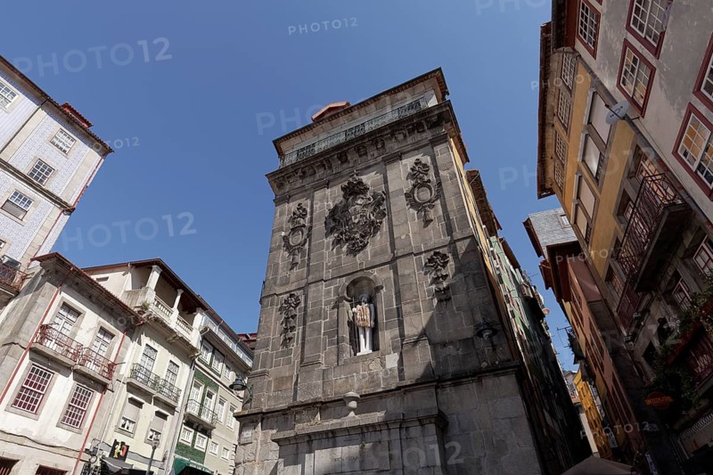 Monumental fountain Fonte da Praca da Ribeira with modern sculpture St. John the Baptist