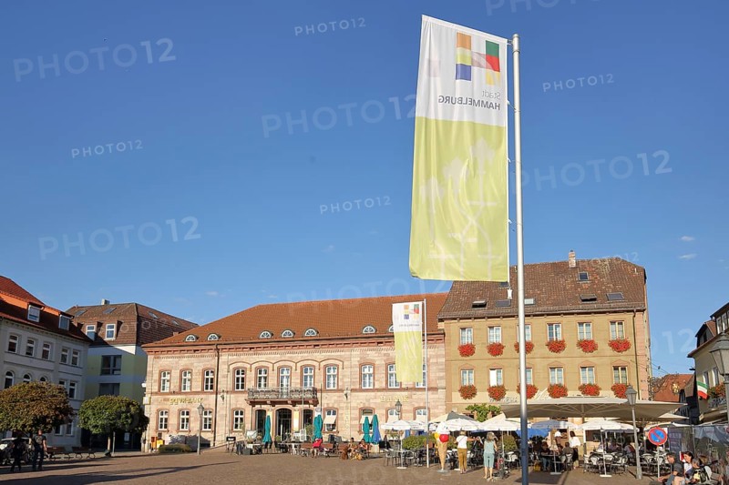 Market place with town flag and street pub