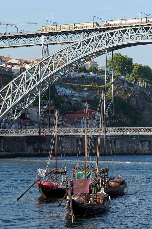 Historic barges with port wine barrels on the Douro River