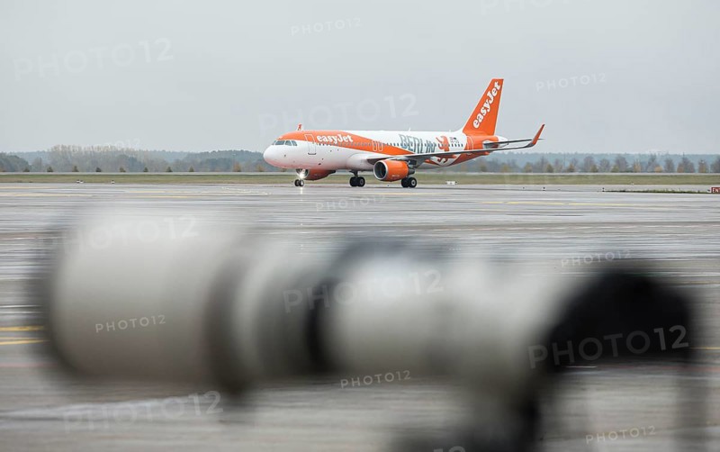 An EasyJet aircraft with the inscription Berlin taxis across the tarmac at BER Airport. Schoenefeld