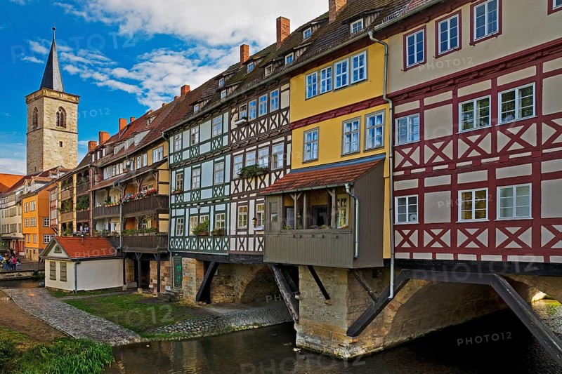 Half-timbered houses of the Kraemerbruecke with the river Gera and the Aegidienkirche