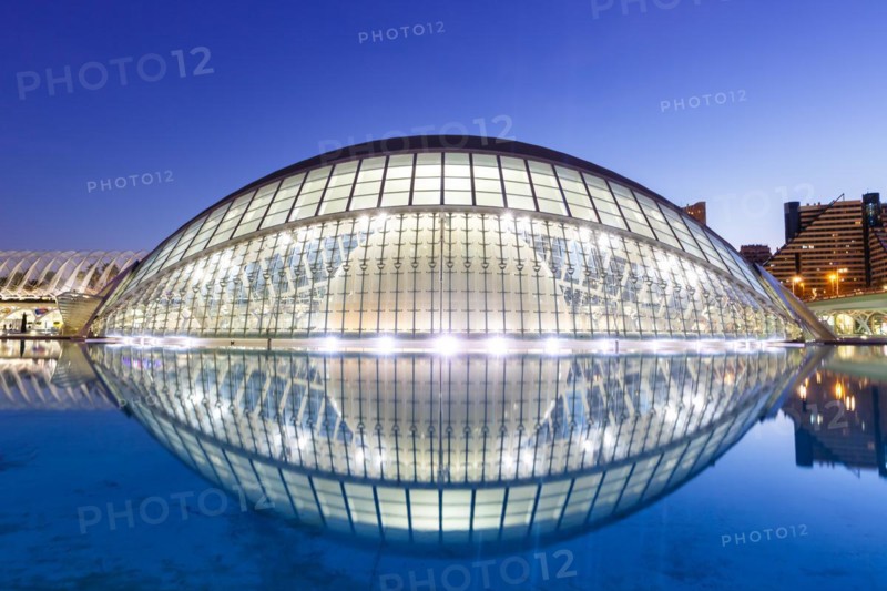 Ciutat de les Arts i les Ciencies with Hemisferic building modern architecture by Santiago Calatrava at night in Valencia