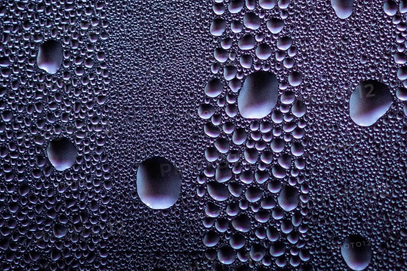 Drops stand out on a window pane in Berlin