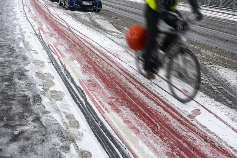 Motion blurred cyclist cycling on slippery bike path