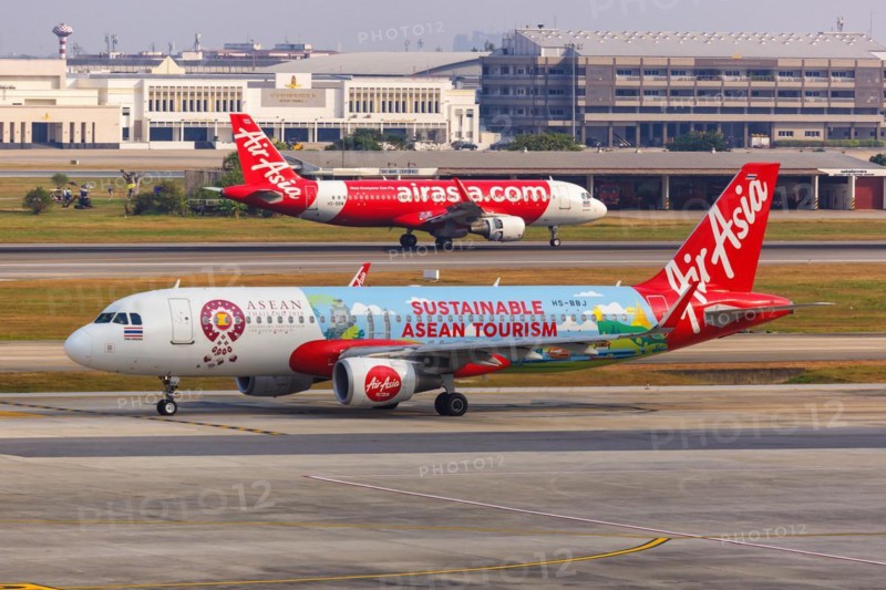 A Thai AirAsia Airbus A320 aircraft with registration HS-BBJ and Sustainable ASEAN Tourism special livery at Bangkok Don Mueang Airport
