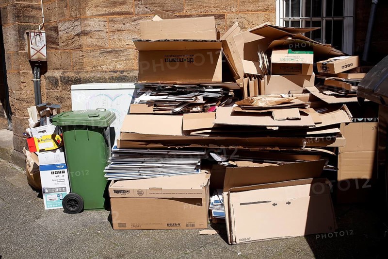 Cartons and stacks of waste paper