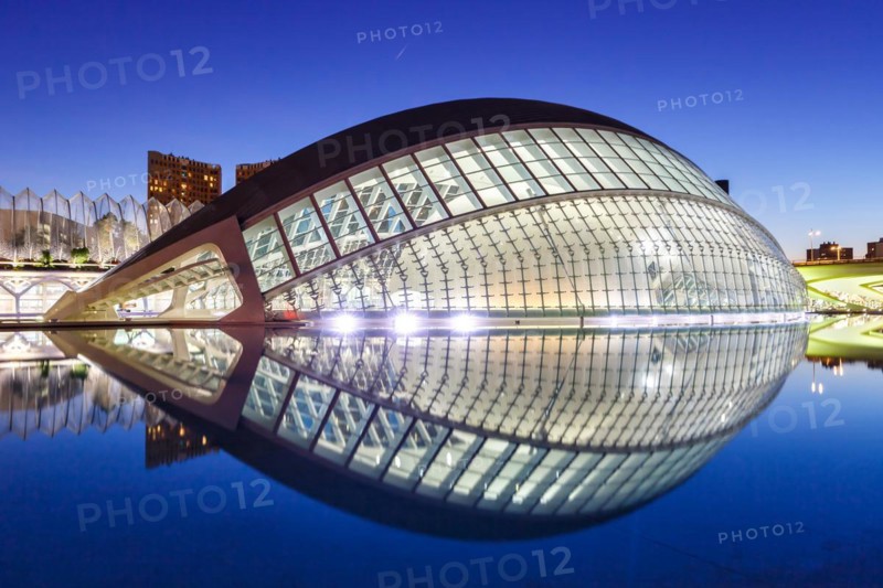 Ciutat de les Arts i les Ciencies with Hemisferic building modern architecture by Santiago Calatrava at night in Valencia