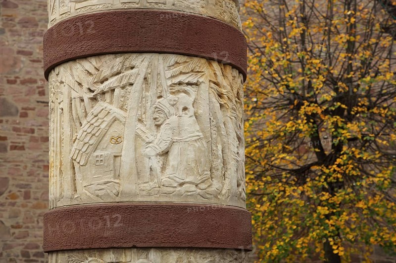 Fairy tale fountain with relief and fairy tale figure to the fairy tale Hansel and Gretel with witch and gingerbread house