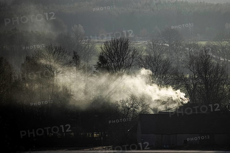 A chimney smokes in Nieder Seifersdorf