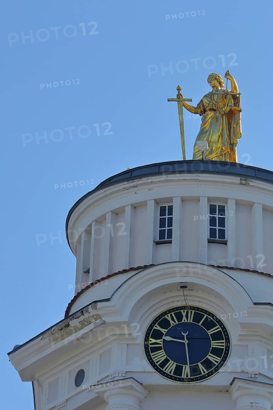 Golden sculpture Themis with sword and beam scales