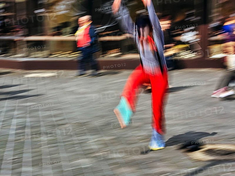 Colourful clown beats a wheel