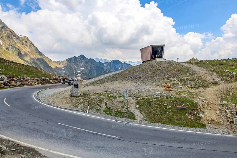 View on pass road alpine pass mountain road pass height of 2509 metres high Timmelsjoch Passo Rombo and pass museum on Austrian territory and Italian territory