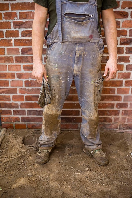 Dirty and tattered dungarees of a construction worker. Berlin