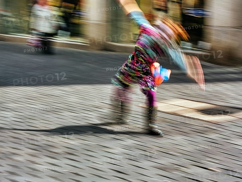 Colourful clown doing a cartwheel