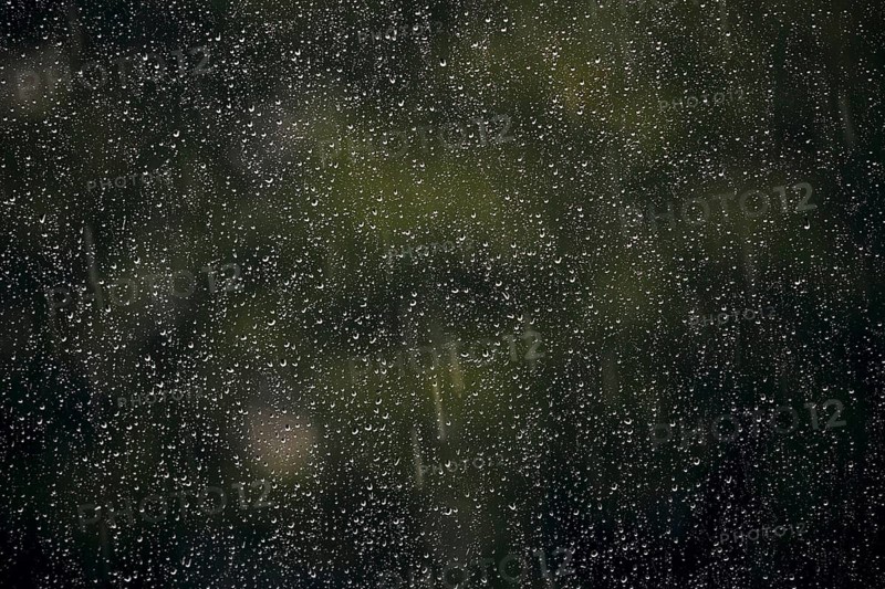 Raindrops hang on a window pane. Berlin