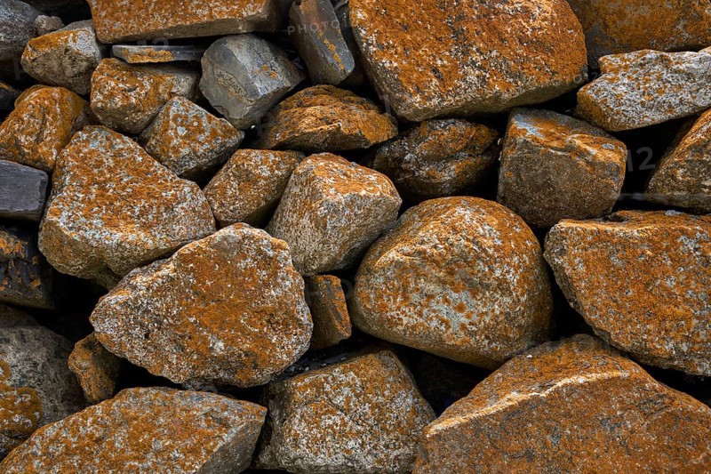 Quarry stone wall with lichens