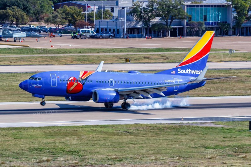 A Southwest Airlines Boeing 737-700 aircraft with registration N409WN and Triple Crown One special livery at Dallas Love Field