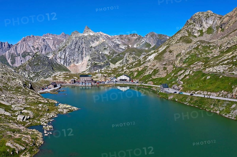 View from the Great St. Bernard Pass over the mountain lake Lac du Grand-St-Bernard to the Italian Alps with the peak Pain de Sucre in Italy