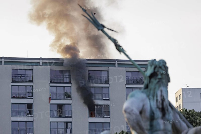 Flames rise from a flat near the Neptune Fountain in Berlin. Berlin