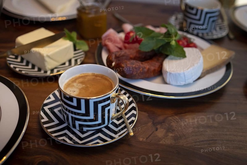 Breakfast with a coffee in a luxurious cup.