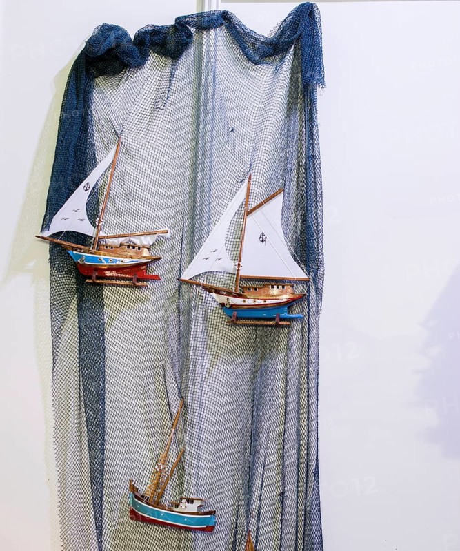 Set of small colorful model sailboats