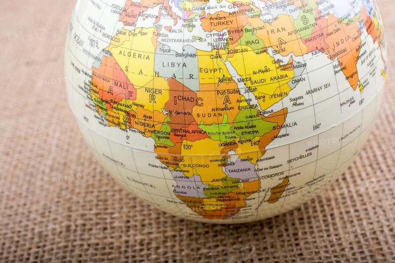 Globe placed on a brown fabric background