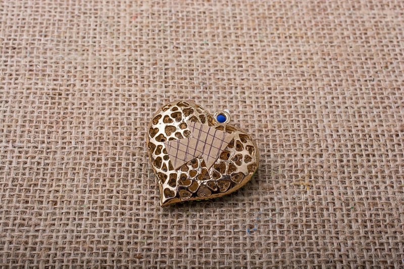 Heart shaped object with an arrow on canvas