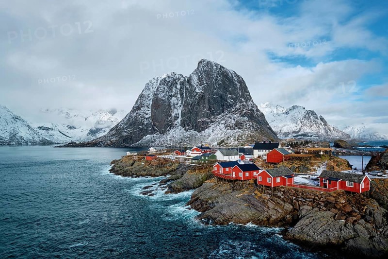 Hamnoy fishing village with red rorbu houses in Norwegian fjord in winter. Lofoten Islands