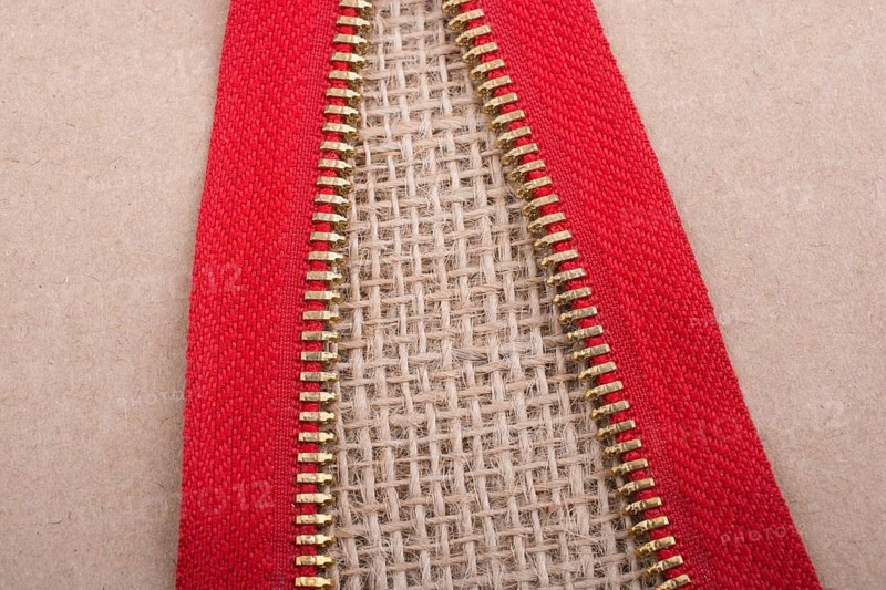 Closeup of a colorful zipper on linen canvas