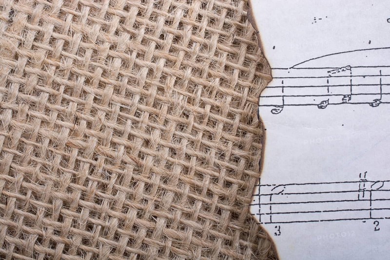 Musical notes on paper placed on a linen canvas