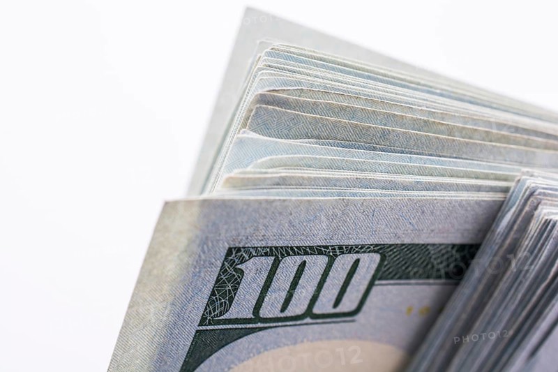 American 100 dollar banknotes made of paper placed on white background