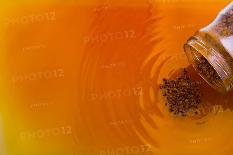 Coffe slowly dissolve in the hot water