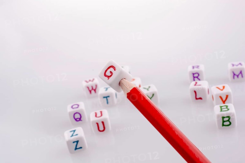 Pencil with Letter cubes on a white background