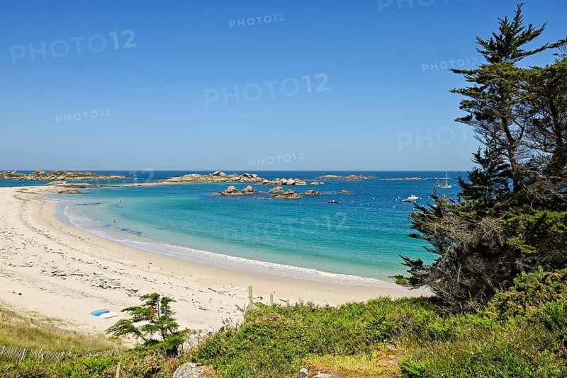 Bay with sandy beach and granite rocks