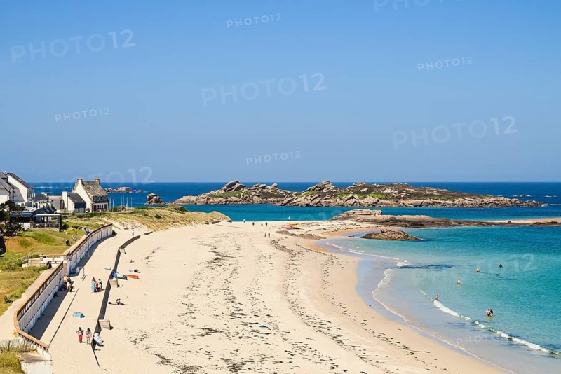 Bay with sandy beach and granite rocks