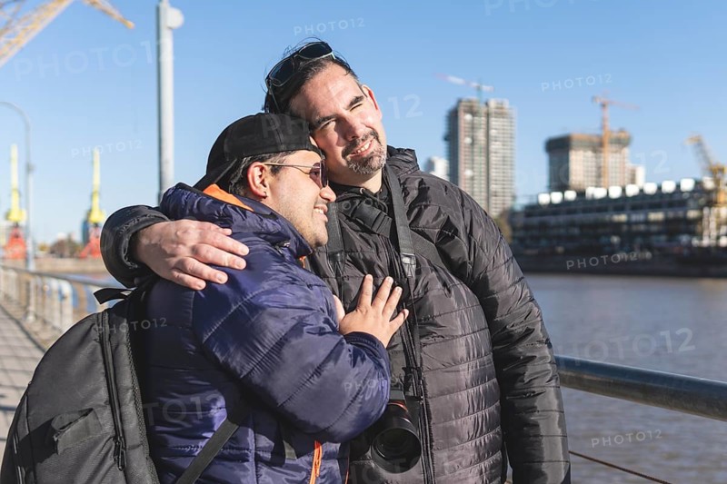 Tourist gay couple posing in Puerto Madero