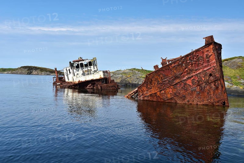 Rusty shipwreck on the Atlantic Strait in Norway