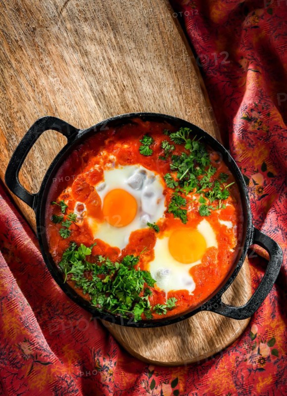 Shakshouka dish in a cast iron pan